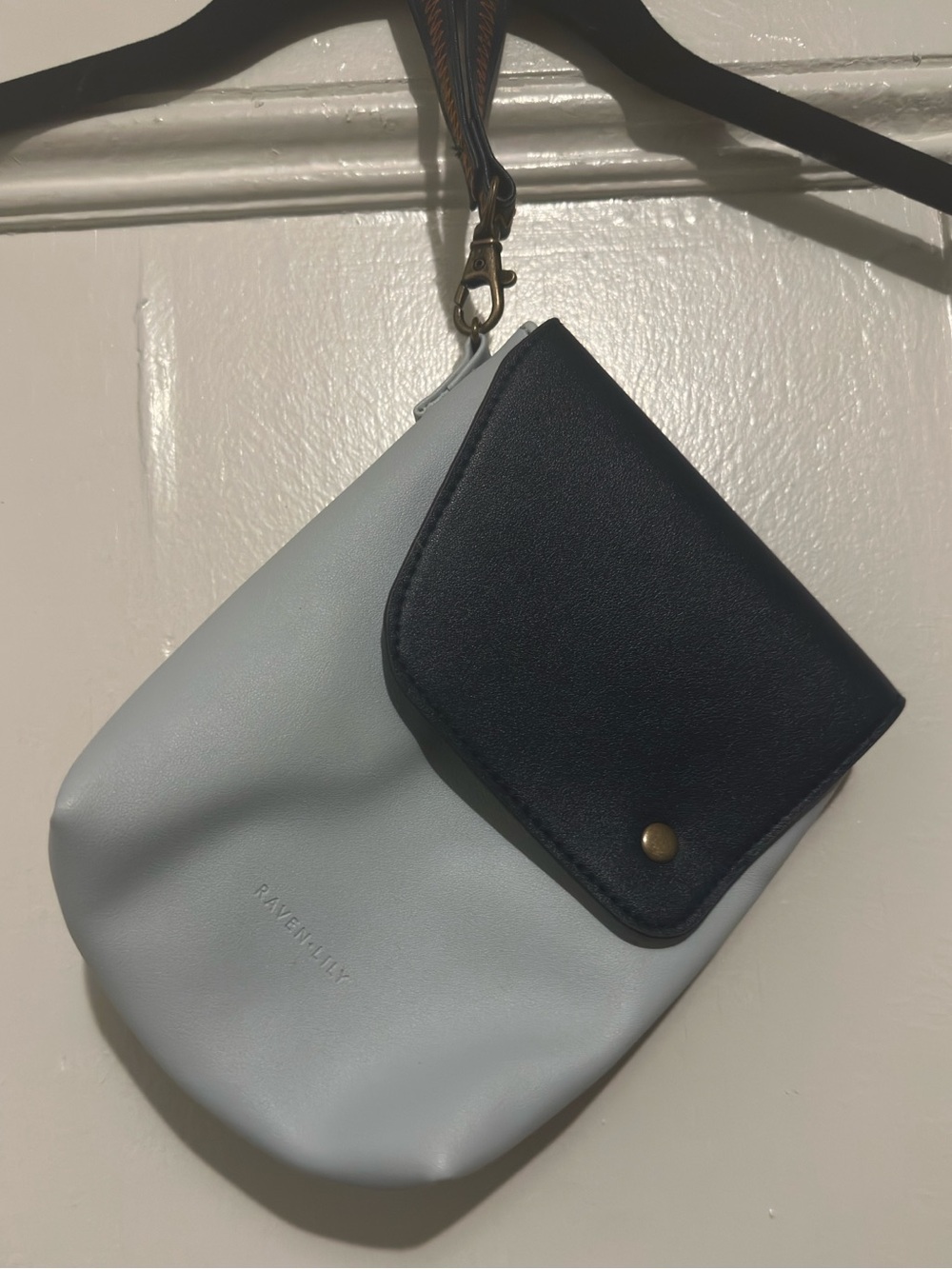 Raven + Lily Two-Tone Light and Navy Blue Wristlet Pouch with Snap Flap.